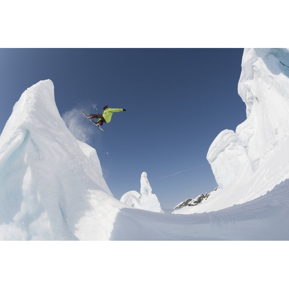 Professional snowboarder Kevin Pearce extreme snowboarding on formations on a glacier Haines Southeast Alaska Image 1