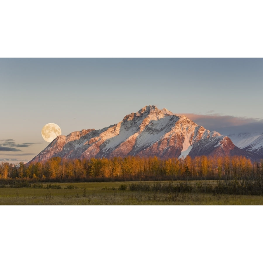 COMPOSITE Scenic sunset view of Pioneer Peak with the full moon rising over the Image 1