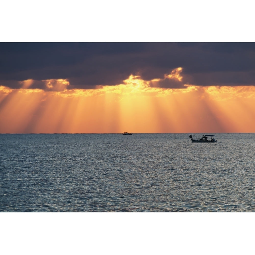 Dramatic sky with sun rays filtering down out of the storm clouds over the horizon; Paphos Cyprus Print Image 1