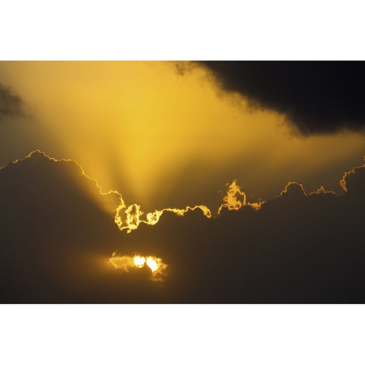 Close up of the sun coming through clouds with rays beaming up at sunrise; Akumal Quintana Roo Mexico Print Image 2