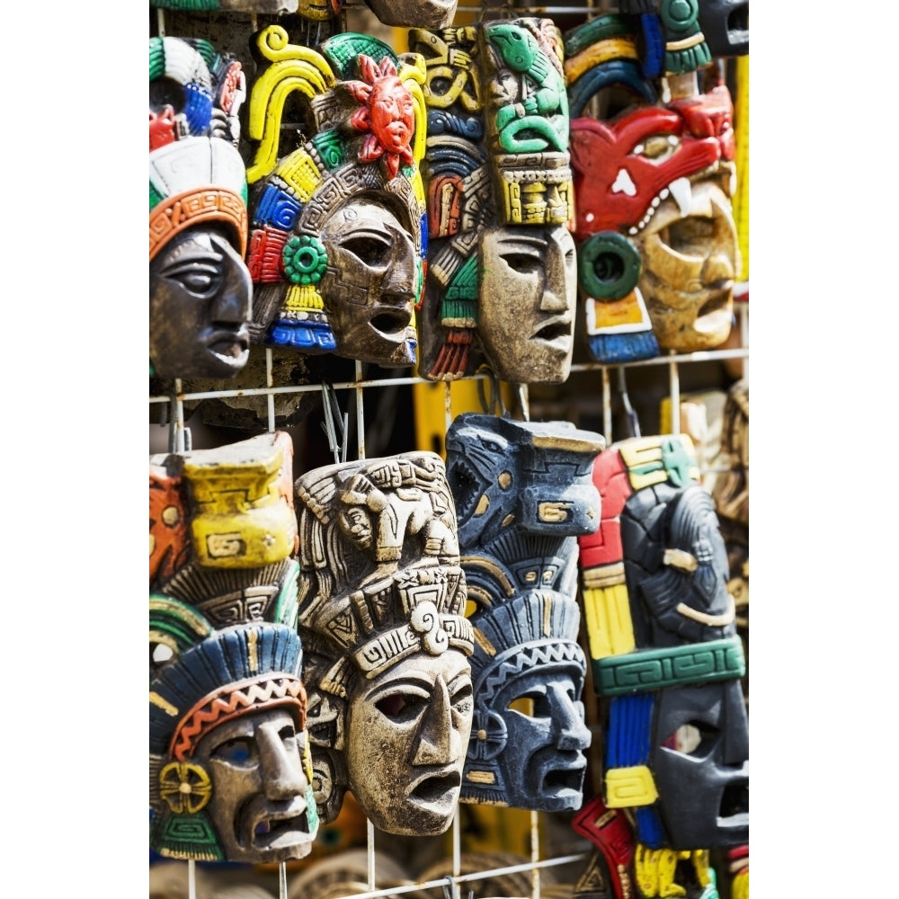 Close up of colourfully painted Mayan masks hanging on display; Akumal Quintana Roo Mexico Poster Print Image 2