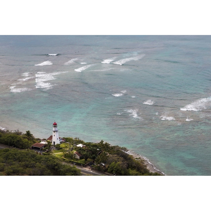 View of Diamond Head Lighthouse with waves breaking in the shallow water in Image 1