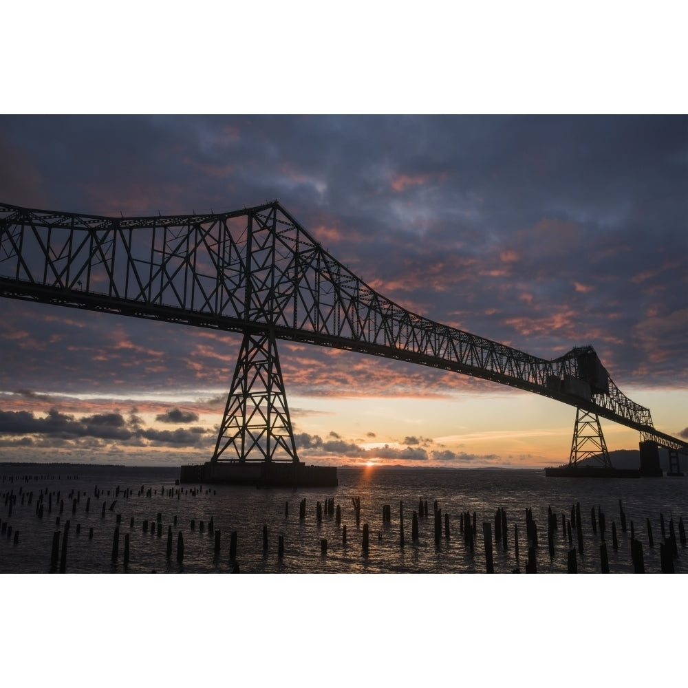 The sun sets over the mouth of the Columbia River; Astoria Oregon United States of America Poster Print Image 2