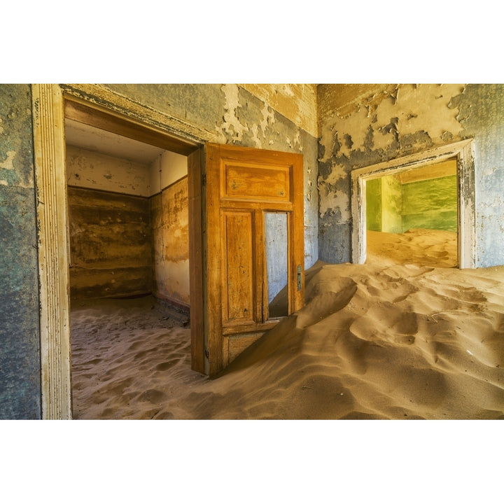 Sand in the rooms of a colourful and abandoned house; Kolmanskop Namibia Poster Print Image 1