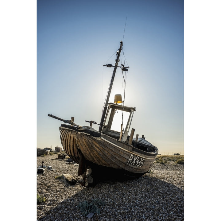 Old boat on a shingle beach; Dungeness Kent England Poster Print Image 1