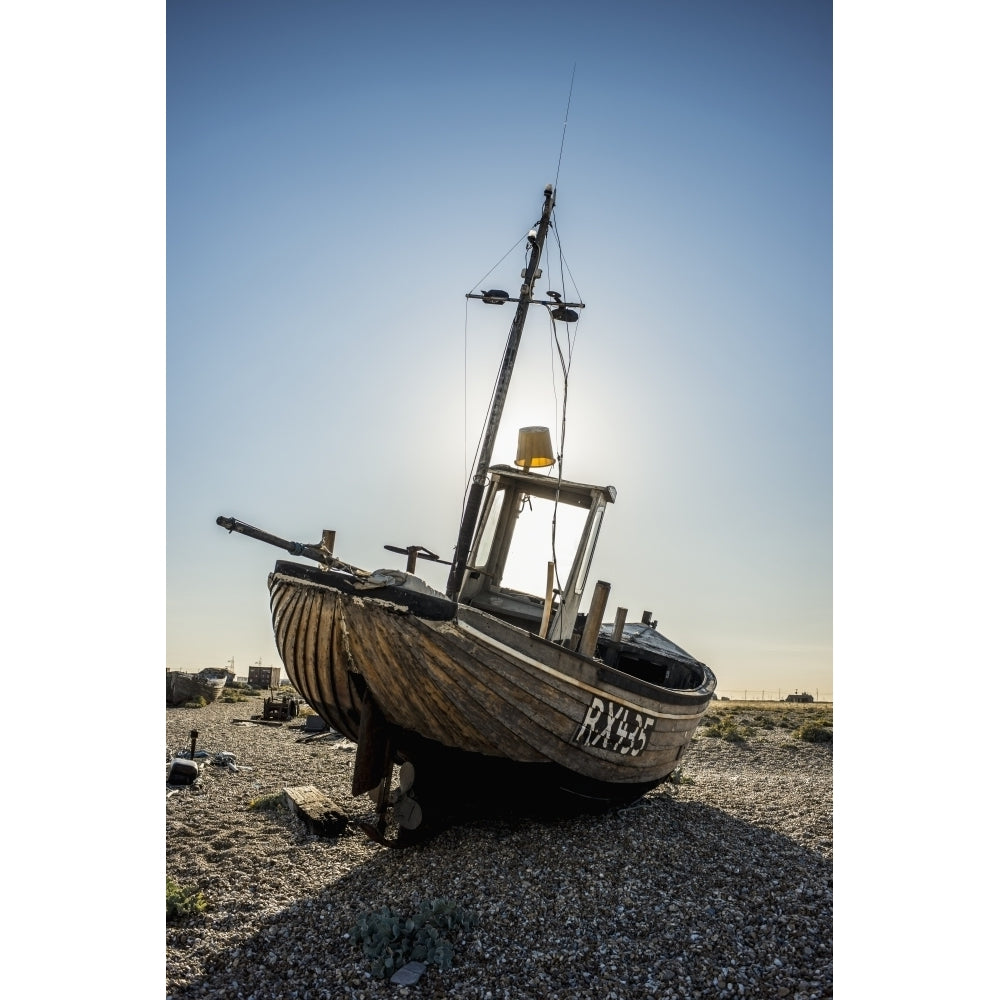 Old boat on a shingle beach; Dungeness Kent England Poster Print Image 2