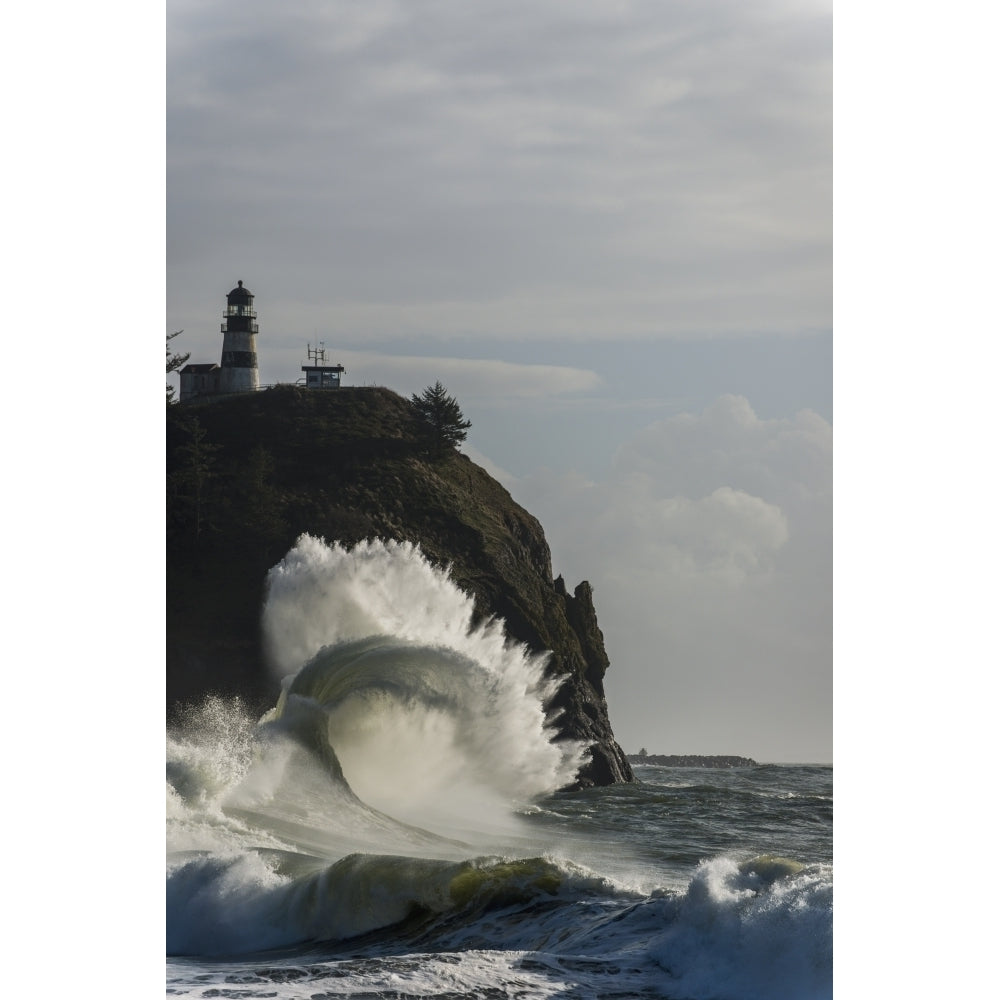 Surf breaks at Cape Disappointment Lighthouse; Ilwaco Washington United States of America Poster Print Image 1