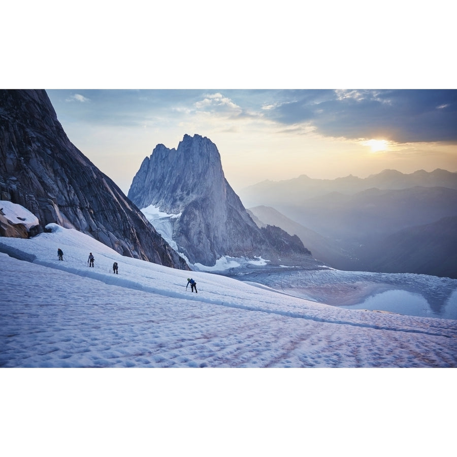 Hiking around a crevice of West Ridge of Pigeon Spire route in the Bugaboos Provincial Park at dawn; British Columbia C Image 1