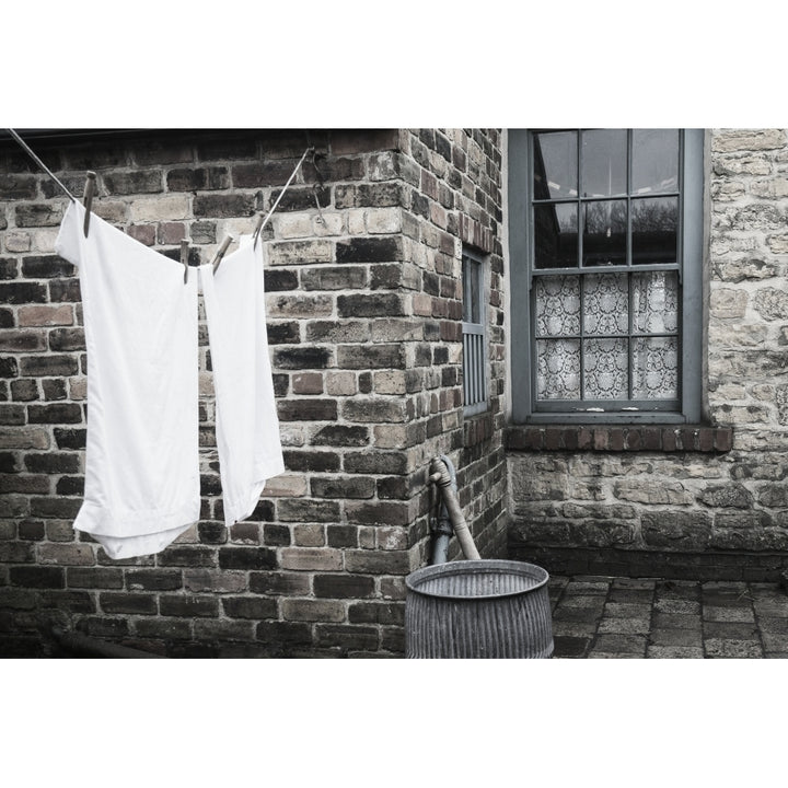 Stone walls of a house with laundry hanging to dry on the clothesline; Beamish Durham England Poster Print Image 2