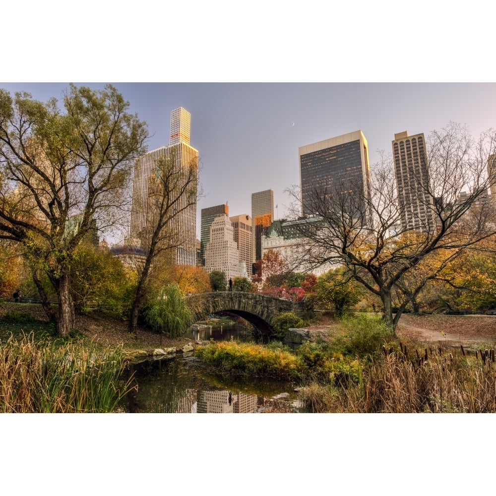 Autumn coloured foliage around Gapstow Bridge Central Park; York City York United States of America Image 1