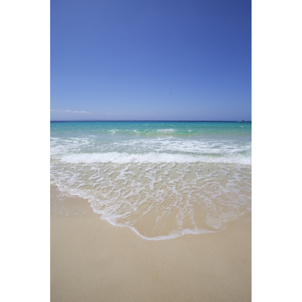 White sand island beach with crystal clear turquoise water and blue sky Poster Print by Chris Caldicott / Design Pics Image 1