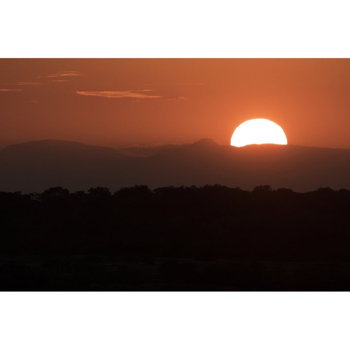 Setting sun overtop of the African landscape; South Africa Poster Print by Robert Postma / Design Pics Image 1