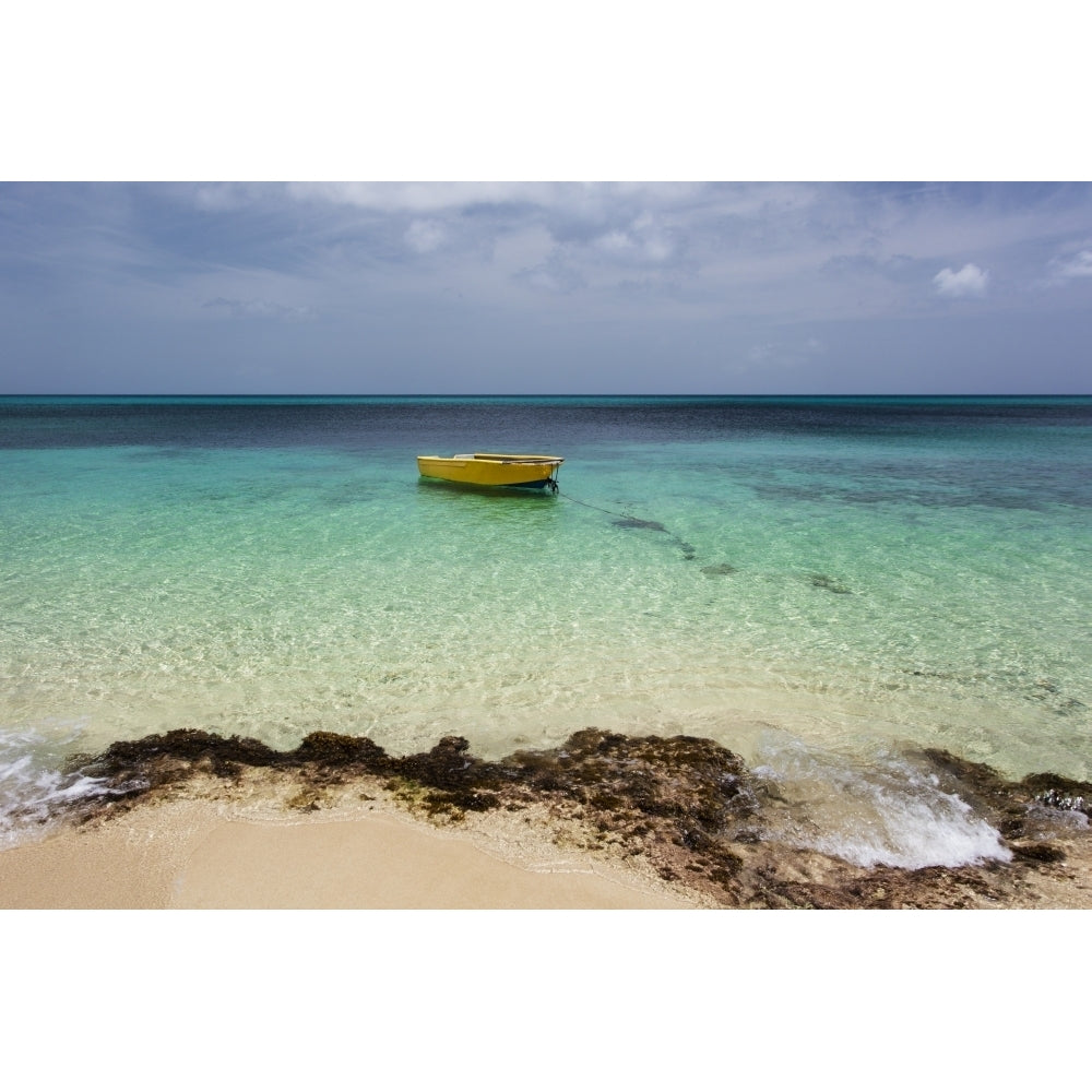 A lone boat in the turquoise water off a tropical island; Frederiksted St. Croix Virgin Islands United States of Amer Image 1