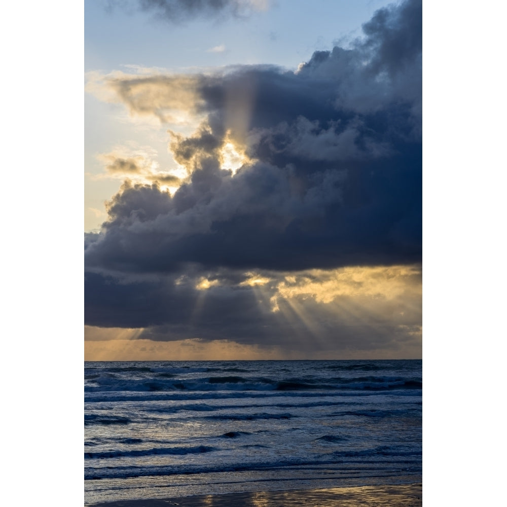 Sunbeams Flow Through Holes In The Clouds Along The Oregon Coast; Cannon Beach Oregon United States Of America by Robert Image 1