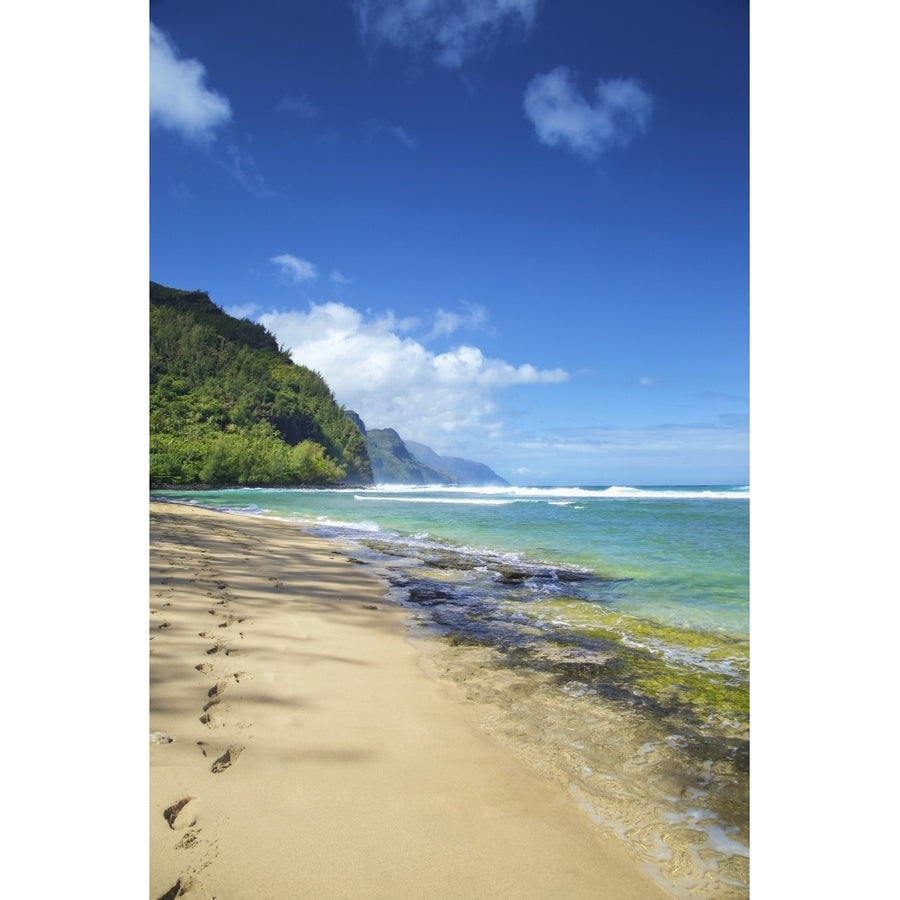 Footprints in the sand along the waters edge on the coastline of the Island of Hawaii; Haena Island of Hawaii Hawaii Image 1