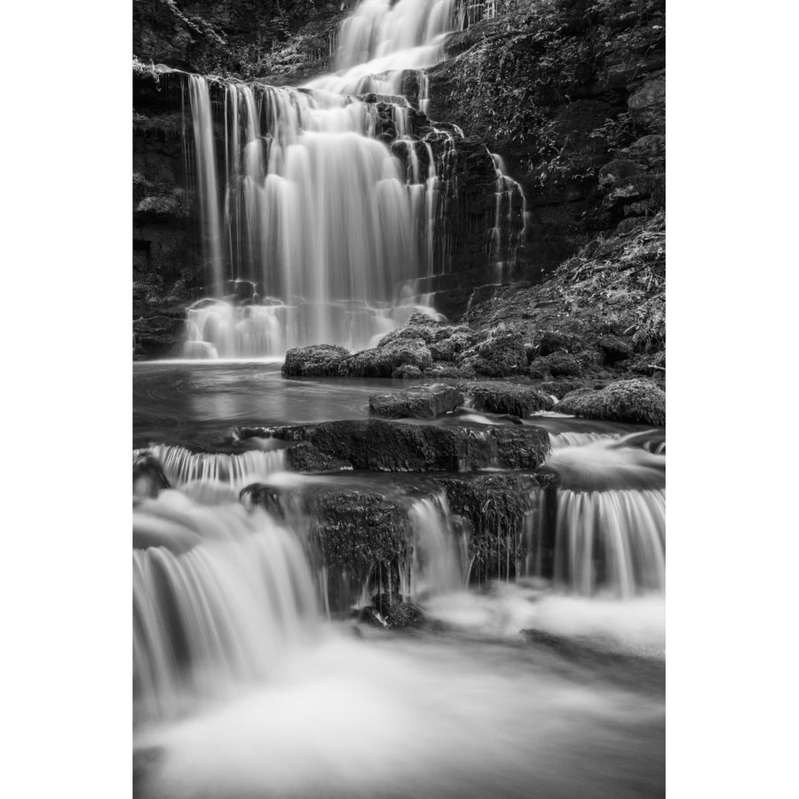 Black and white image of numerous waterfalls flowing over rocks in the Yorkshire Dales; Settle North Yorkshire England Image 1