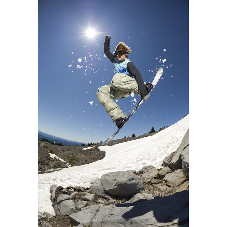 A professional freeriding snowboarder mid-air on Mount Hood; Oregon United States of America by Dean Blotto Gray / Image 1