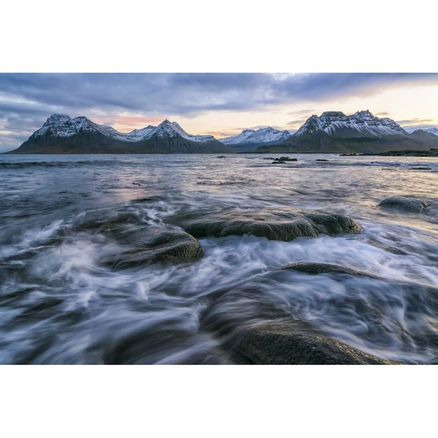 Sunset over the mountains of the Strandir Coast Iceland as the surf pounds the shoreline; West Fjords Iceland by Robert Image 1