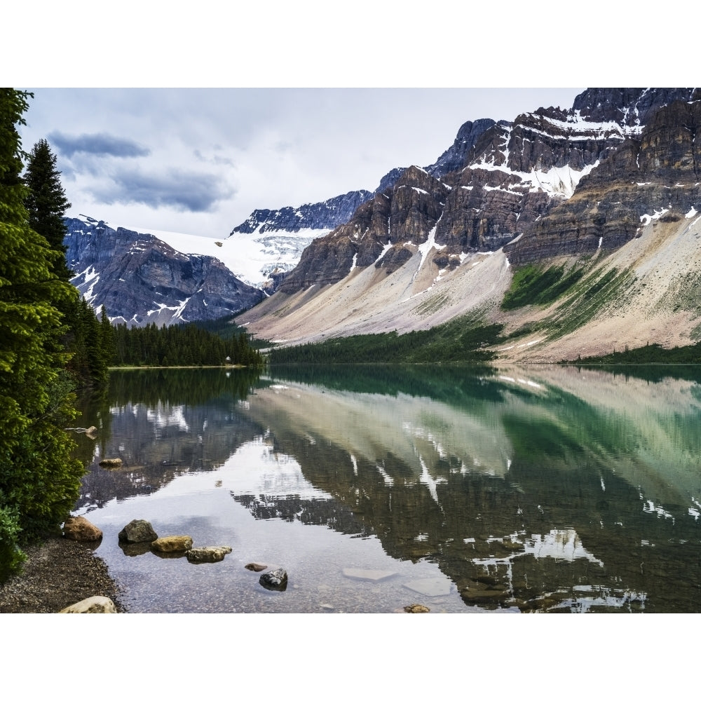 Rugged Canadian Rocky Mountains and glaciers reflected in a tranquil lake Banff National Park; Improvement District No. Image 1