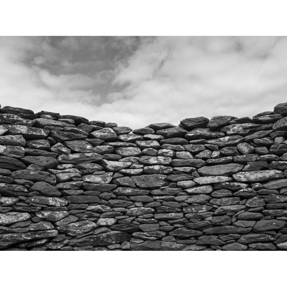 Close-up of a stone wall and clouds in the sky; Ballyferriter County Kerry Ireland by Keith Levit / Design Pics Image 1