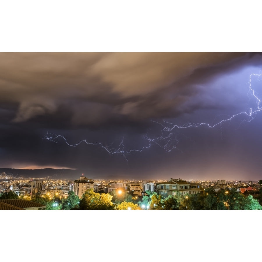 Stormy skies and lightning over a city at night; Cochabamba Bolivia by Robert Postma / Design Pics Image 1