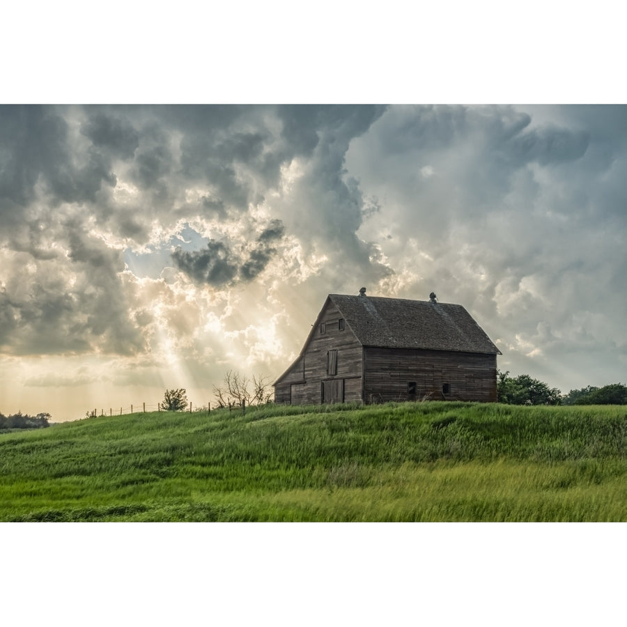 Abandoned barn with storm clouds converging overhead; Nebraska United States of America by Robert Postma / Design Pics Image 1