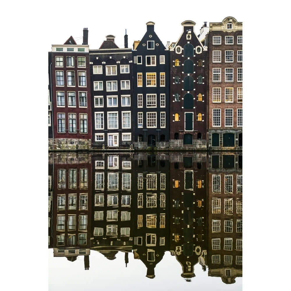 Building facades with a mirror image reflecting in a canal; Amsterdam Netherlands by Michael Interisano / Design Pics Image 1