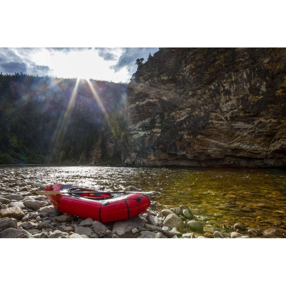 Packraft on the banks of the Charley River sun going down behind ridge in background Yukon-Charley Rivers National Image 1