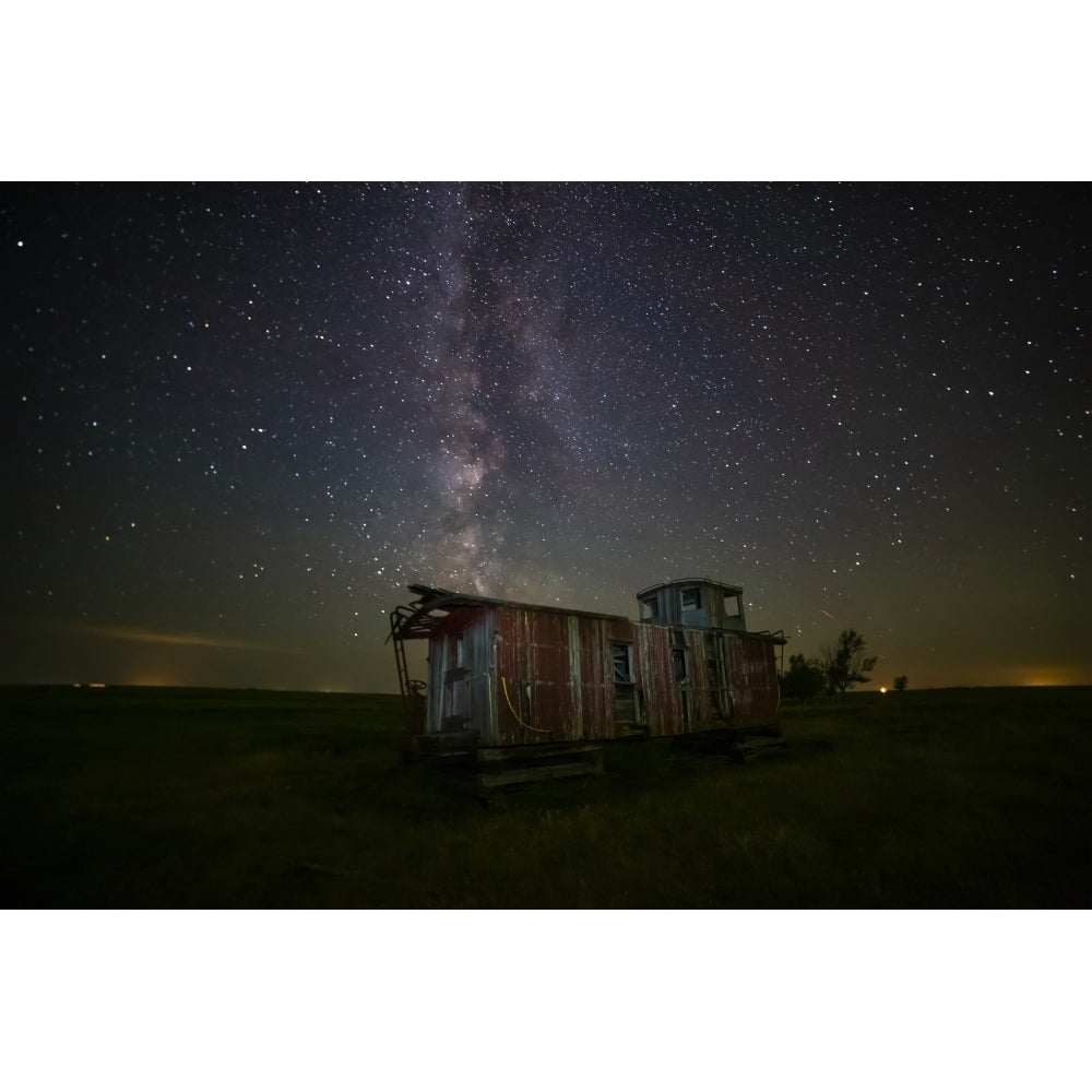 Old caboose at nighttime under a bright starry sky; Coderre Saskatchewan Canada Poster Print by Michael St Laurent Image 1