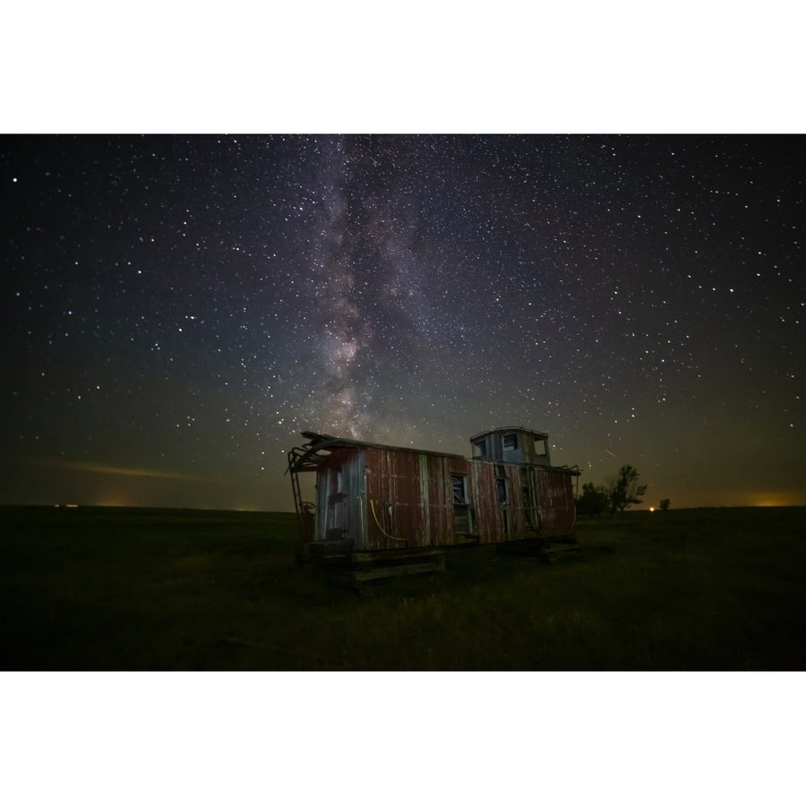 Old caboose at nighttime under a bright starry sky; Coderre Saskatchewan Canada Poster Print by Michael St Laurent Image 1