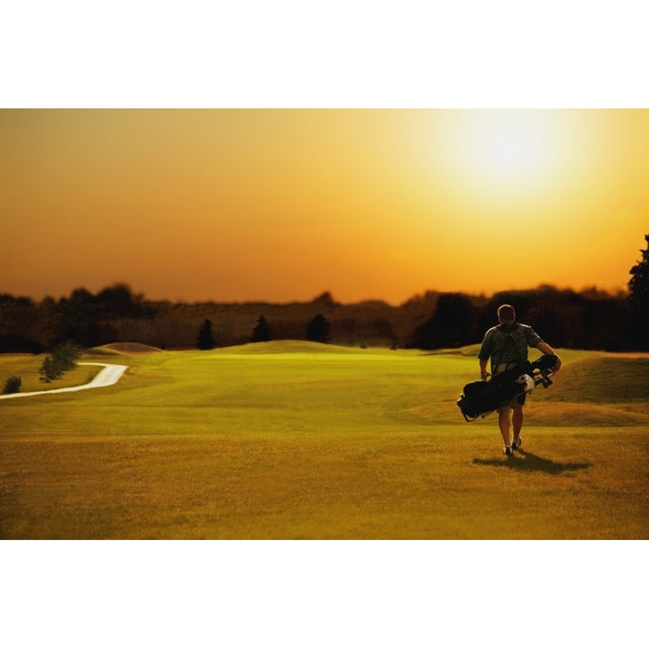 Golfer Walking On A Golf Course Poster Print Image 1