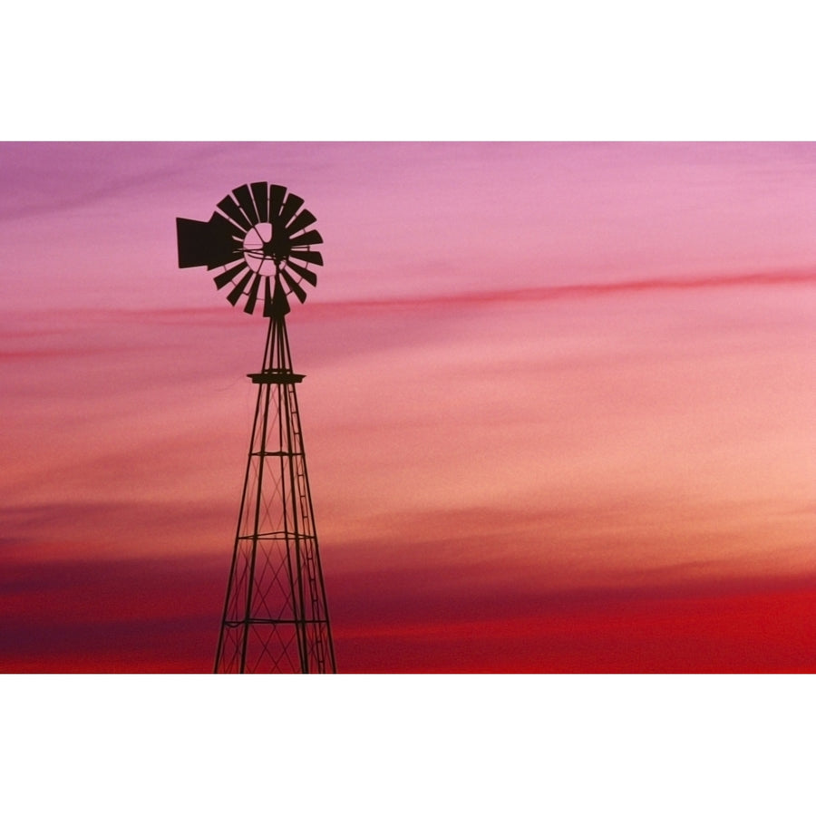 Windmill Silhouette Against Coloured Sky Poster Print Image 1