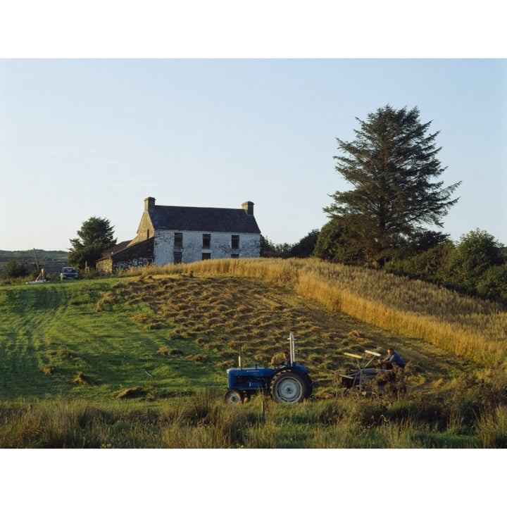 County Cork Ireland; Farmer On Tractor Harvesting Field Poster Print Image 1