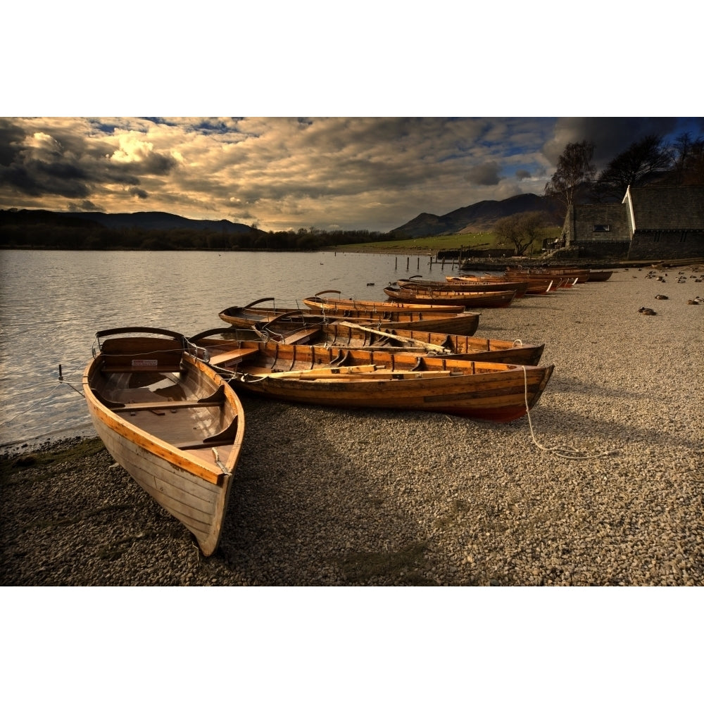 Canoes On The Shore Keswick Cumbria England Poster Print Image 1