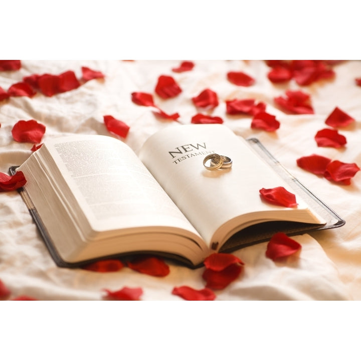 Rings On The Bible; Wedding Rings On The Testament Bible Surrounded By Rose Petals Poster Print by Chris and Kate Kn Image 1