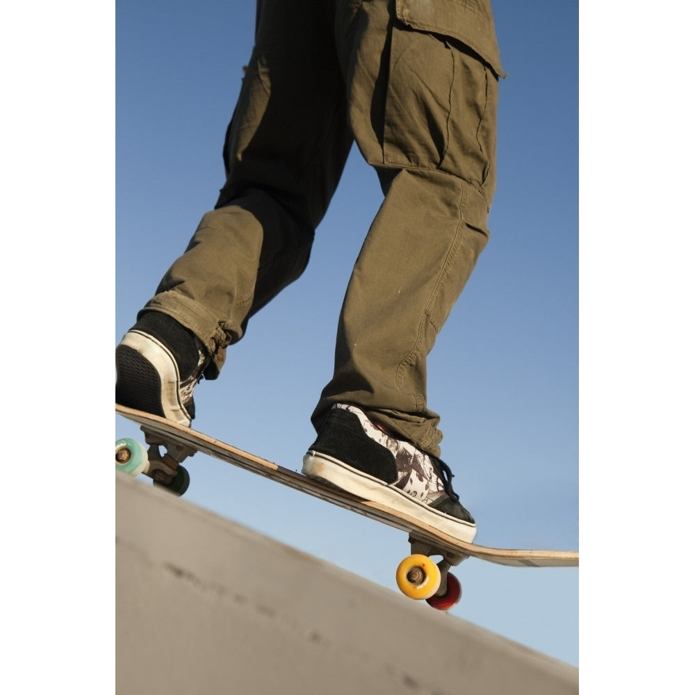 Low Angle View Of Young Male Skateboarder Poster Print Image 1