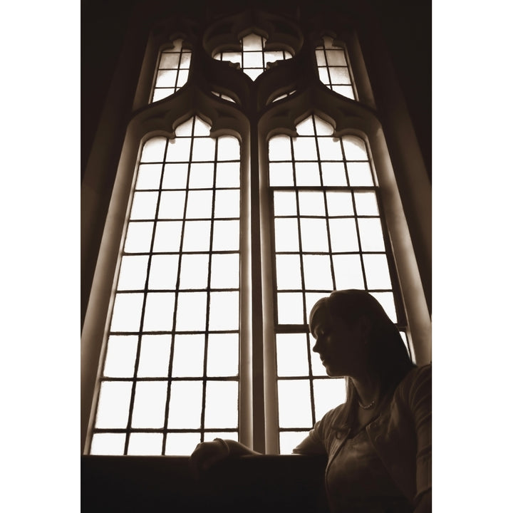 Silhouette Of Woman In Front Of Church Window Poster Print by Nathan Lau / Design Pics Image 1