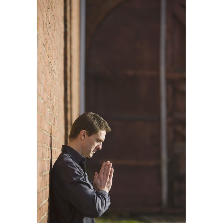 Man Praying Poster Print by Sean White / Design Pics Image 1