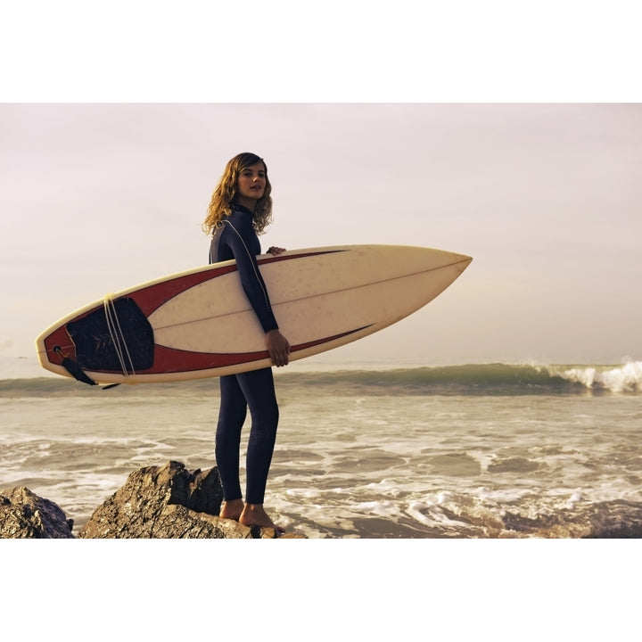 Young Woman With Her Surfboard At The Beach; Tarifa Cadiz Andalusia Spain Poster Print Image 1