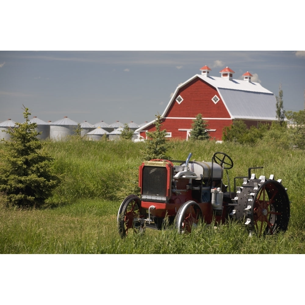 Old Red Tractor In A Field With A Red Barn In The Background; Alberta Canada Poster Print Image 2