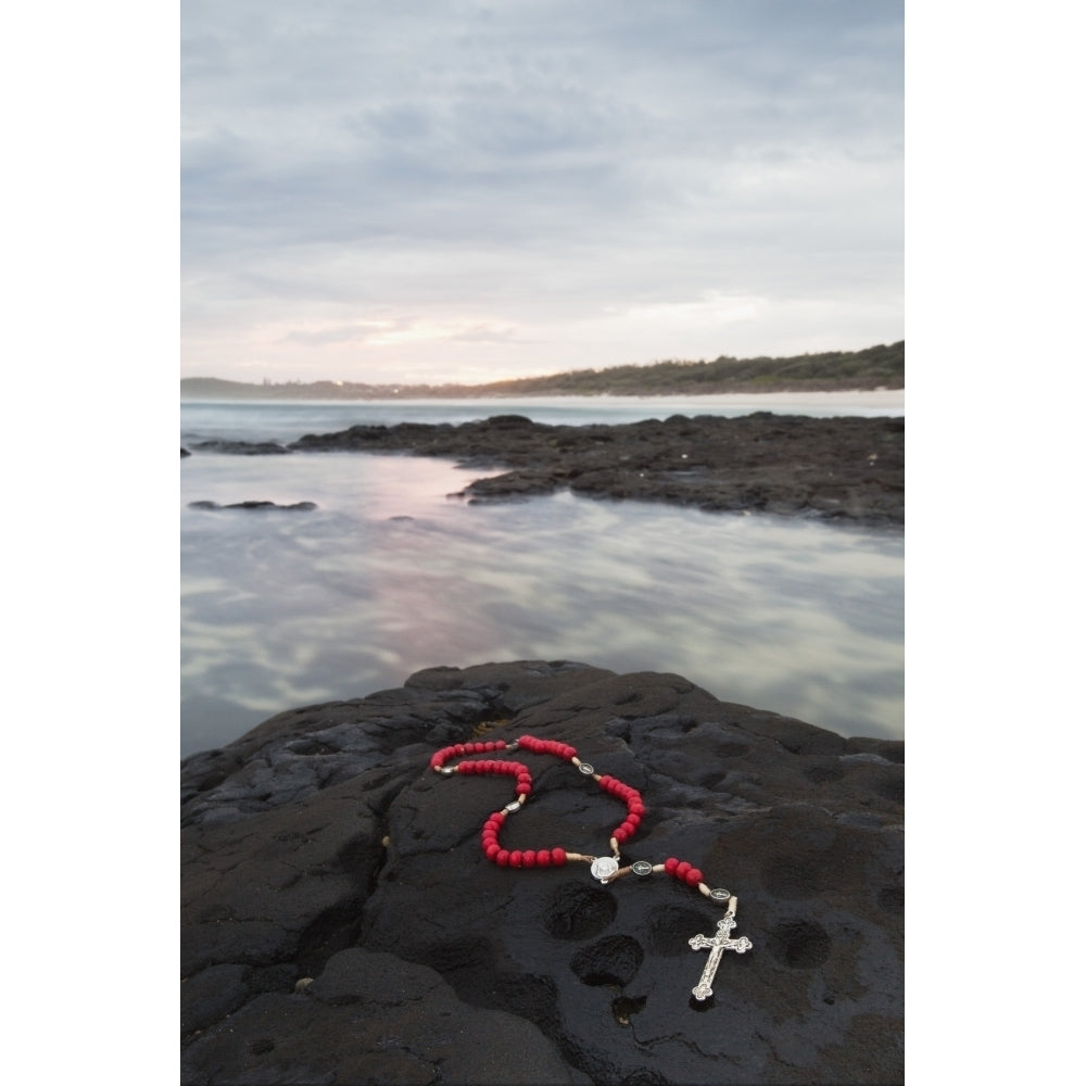 A Cross And Rosary Beads Laying On A Rock At Flat Rock; Ballina South Wales Australia Poster Print by Marcos Welsh Image 2