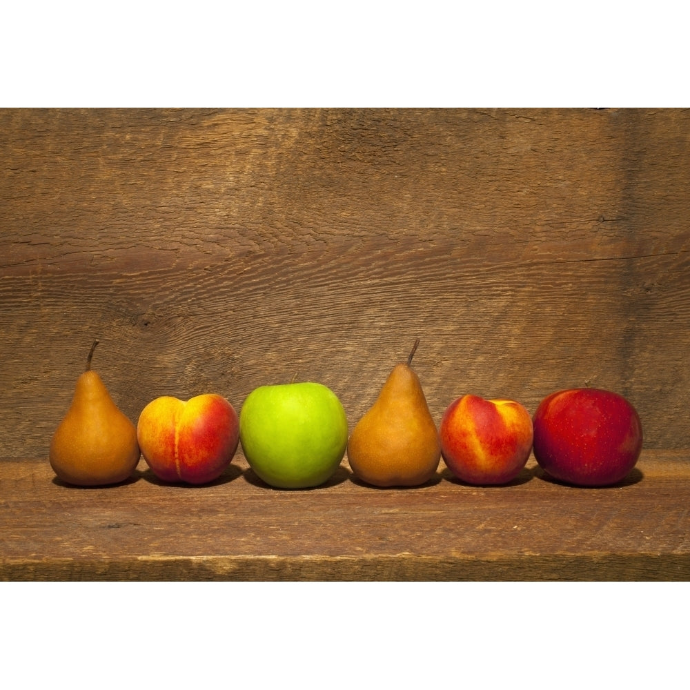 Variety Of Fruit In A Row On A Wooden Shelf; Waterloo Quebec Canada Poster Print Image 2