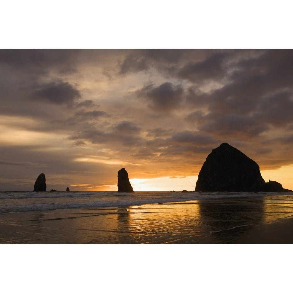 Silhouette Of Rock Formations And Haystack Rock At Sunset; Cannon Beach Oregon United States of America Image 2