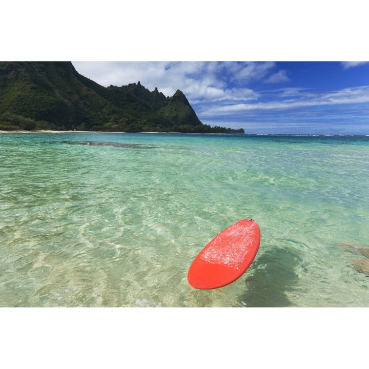 Hawaii Kauai Haena Beach Tunnels Beach Red Surfboard Floating In Shallow Ocean. Poster Print Image 1