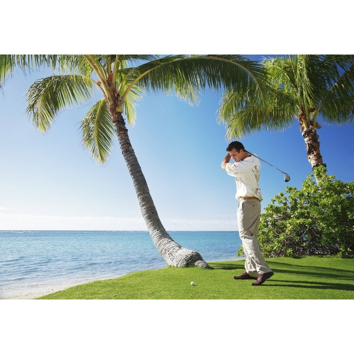 Hawaii Oahu Male Playing Golf Ready To Swing His Golf Club At A Beach Front Golf Course Poster Print Image 2