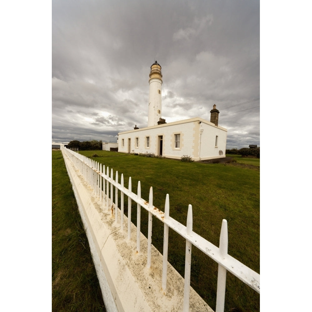 A White Fence Beside Barns Ness Lighthouse; Lothian Scotland Poster Print Image 1