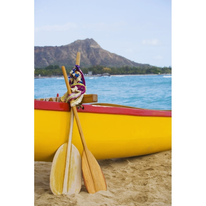 USA Hawaii Oahu Honololu funeral for Don Ho; Waikiki Canoe paddles and Lei leaning on outrigger canoe Image 1