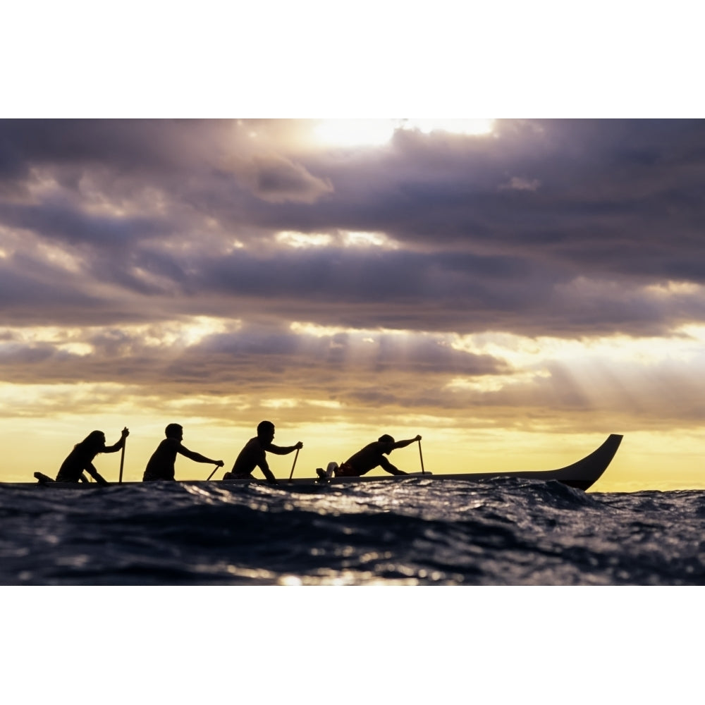 Outrigger Canoe And Paddlers Silhouetted At Sunset Sunrays Through The Clouds by Vince Cavataio / Design Pics Image 1