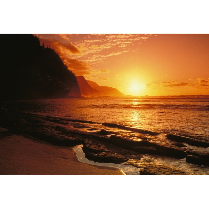 Hawaii Kauai Napali Coast At Sunset Bright Orange Sky And Calm Ocean. Poster Print Image 1