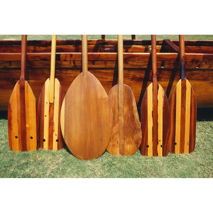 Hawaii Different Shaped Canoe Paddles In Front Of Koa Canoe Poster Print Image 1